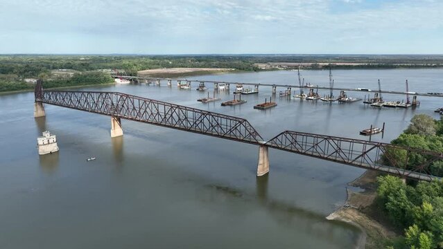 Chain of Rocks on the Mississippi River above St Louis with water tower, old historic bridge and the new bridge with construction work -aerial view