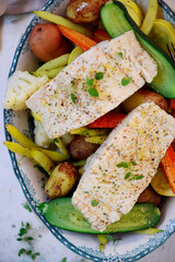 Poashed cod with vegetables and aioli .top veiw