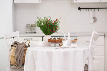 Christmas home interior in white kitchen Christmas chocolate bundt cake with fresh berries and rosemary. Winter baking. christmas trees. High quality photo