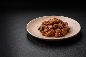 Delicious vegetable stew of potatoes, beef meat, mushrooms, carrots, salt, spices and herbs