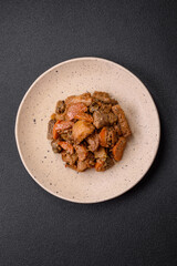 Delicious vegetable stew of potatoes, beef meat, mushrooms, carrots, salt, spices and herbs