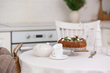 Christmas home interior in white kitchen Christmas chocolate bundt cake with fresh berries and rosemary. Winter baking. christmas trees. High quality photo