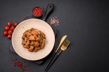Delicious vegetable stew of potatoes, beef meat, mushrooms, carrots, salt, spices and herbs