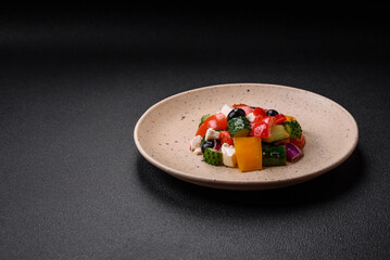 Delicious juicy Greek salad with feta cheese, olives, cucumber and tomatoes