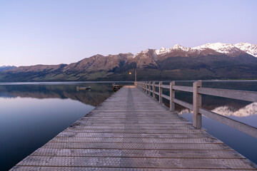 Fototapeta na wymiar New Zealand landscape in Glenorchy near Queenstown with mountains and lake at sunrise