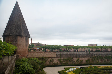 Architecture of the red brick Sainte Cécile cathedral and its gardens in the town of Albi in France