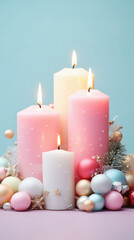 Candles in a vase with a plant in it on a pink background.