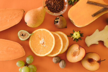 Healthy orange organic fruit, vegetables, wild rice and spices.