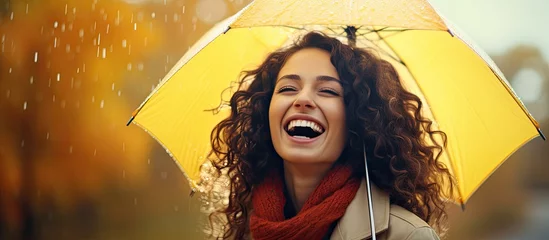 Fotobehang Joyful girl with umbrella in autumn rain bad weather © 2rogan