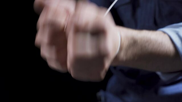 Handcuffed man taken hostage.