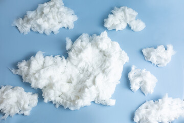 background texture of cotton wool clouds on a blue background for a newborn photo shoot - obrazy, fototapety, plakaty