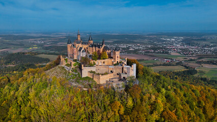 Fototapeta na wymiar Aerial drone view of medieval Hohenzollern castle on top of hill in autumn, Baden-Wurttemberg, Germany.