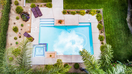 aerial of pool with cloud reflection