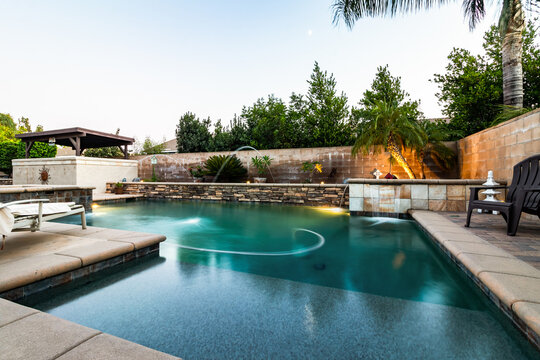 backyard with pool and lights