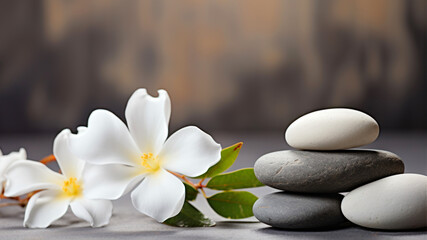 Fototapeta na wymiar Spa stones and flower on wooden background. Zen and relaxation concept