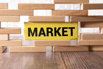 Business concept. Against the background of business graphics and pens, a sign with the inscription - MARKET OVERVIEW