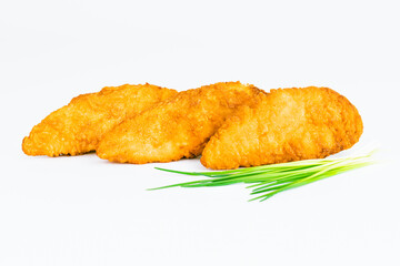 Breaded Chicken Inner Fillet on a White Background,Chicken Breaded Raw Meat.Chicken Breaded Fillet.Fast food. Fast cooking. Breaded chicken nuggets. Homemade food at home.
