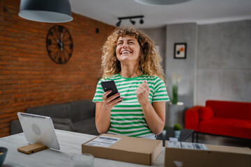 one woman checking box of received package or product at home