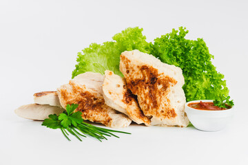 Chicken fillets fried until half cooked, semi-finished product with fresh herbs on a white background. Fast cooking.Fast homemade food.Fast food. Quick cooking at home. Copy space.