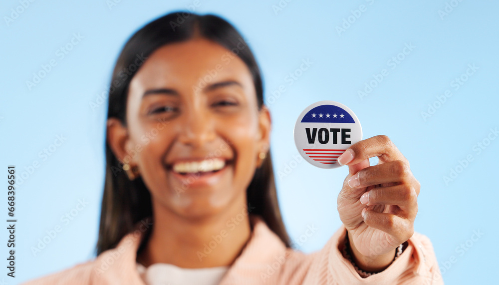 Wall mural woman, hand and pin for vote by showing in studio for mock up in politics on blue background. indian