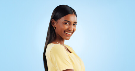 Portrait, smile and Indian woman with joy, fashion and happiness on a blue background. Profile,...