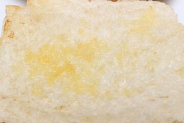 close up of bread. bread with butter. bread and butter. bread texture. food details.