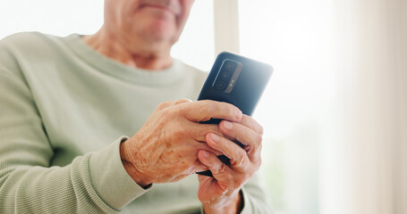 Home, closeup and senior hands with a cellphone, typing and connection with social media, digital app and contact. Old man, pensioner or mature guy with a smartphone, mobile user and search internet