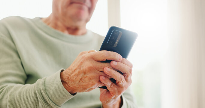 Home, closeup and senior hands with a cellphone, typing and connection with social media, digital app and contact. Old man, pensioner or mature guy with a smartphone, mobile user and search internet