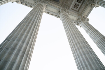 concrete architectural aspects with columns and etchings and statues