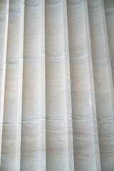 concrete architectural aspects with columns and etchings and statues