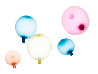 Inflated rubber colorful balloons fly in air. Many colorful inflated balloons in red, blue, yellow throw scatter. Toy for kid to play in birthday party and celebrate, white background isolated