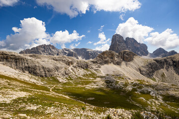 Fototapeta na wymiar Breathtaking Dolomite Alps rise majestically, showcasing their rugged beauty under pristine sky.