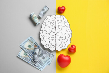 Emotional and rational. Paper human brain, dollar banknotes and red hearts on color background,...