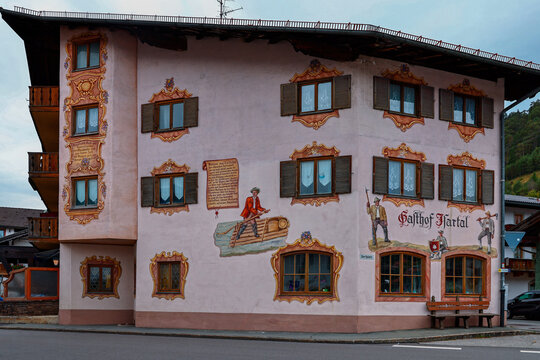 German traditional architecture half-timbered painted wooden houses in historical center Wallgau, Upper Bavaria, Germany, Octouber 10, 2023.