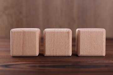 Cubes with abbreviation ISO on wooden table, closeup