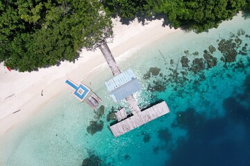 Aerial view of jetty and boats in Wayag Ranger Patrol Post, Raja Ampat, West Papua, Indonesia....