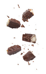 Pieces of chocolate bars falling on white background