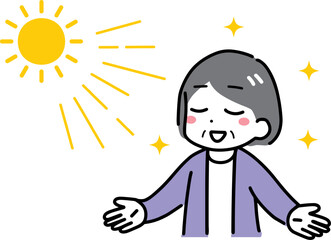 日光浴をしているシニアの女性