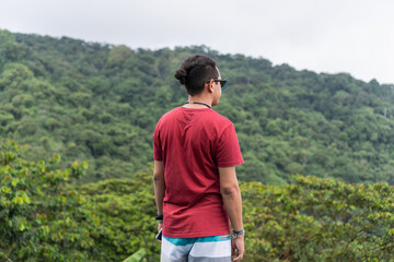 Latin Man on his back with the mountain in the background