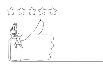 Single continuous line drawing young smiling Arabian man sitting on thumbs up typing on laptop. Happy satisfied Arabian man giving 5 gold stars. Online shop review. One line design vector illustration