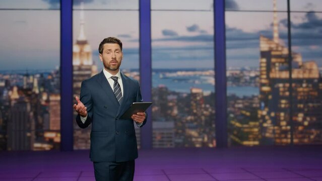 Man presenter lighting breaking news in tv studio. Newsreader hosting newscast