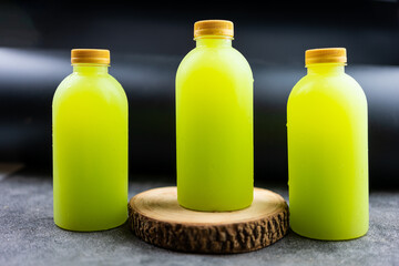 Three guava juice in plastic bottle with gold lid