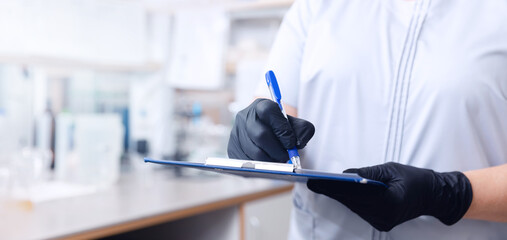 Laboratory assistant control production beer, analysis drink in glasses. Concept brewery food industry