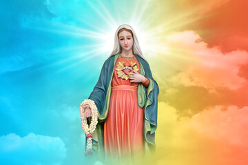 Statue of Our lady of grace virgin Mary with beautiful Sky Pastel with abstract colored background...