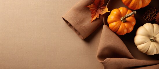 Thanksgiving themed table with fall colors and decorations viewed from above