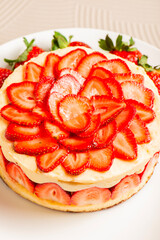 Delicious Fraisier Cake with a Genoese Sponge and Diplomat Cream, decorated with fresh strawberries. 