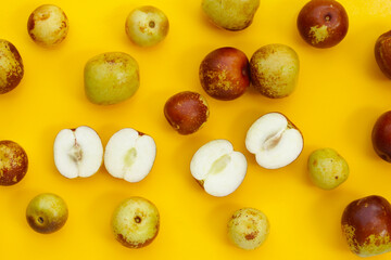 Fresh jujube fruit on yellow background