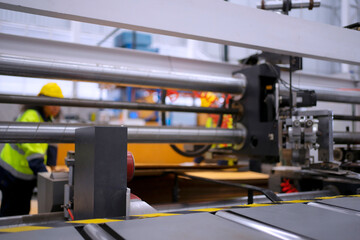 Blue collar worker and cardboard package factory.