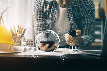 civil engineer or architect business useing calculator about calculate the cost with for working building plan design project in office.