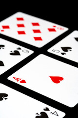 Playing cards on black background studio shot